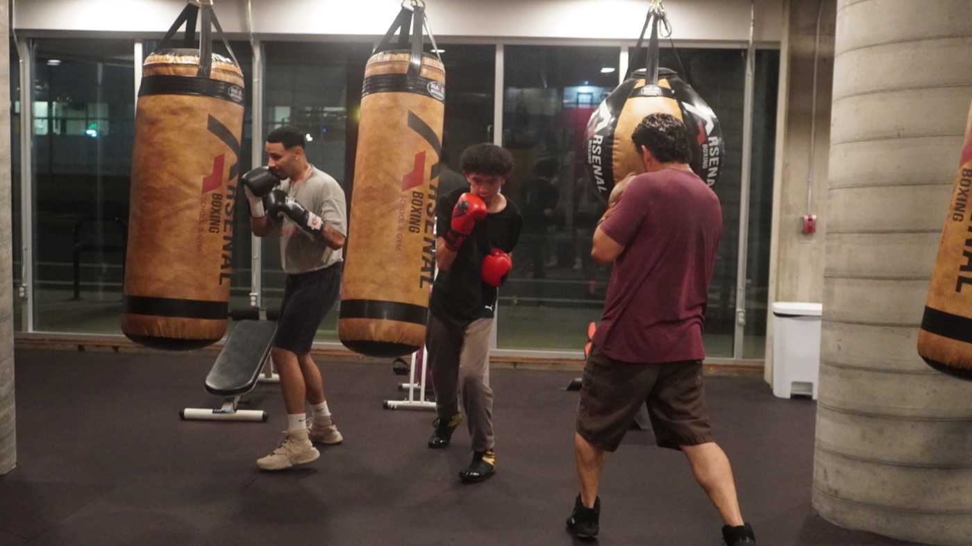 Fighters working the Arsenal heavy bags